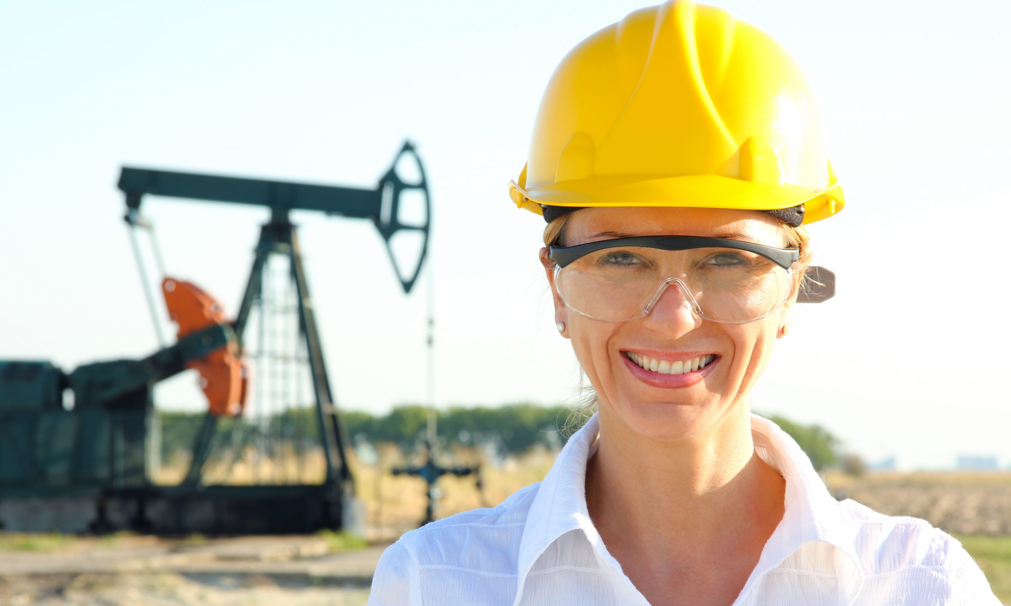 croppedawomanwearingahardhatandsafetyglassesinanoilfield460454381_4927x3252.jpeg